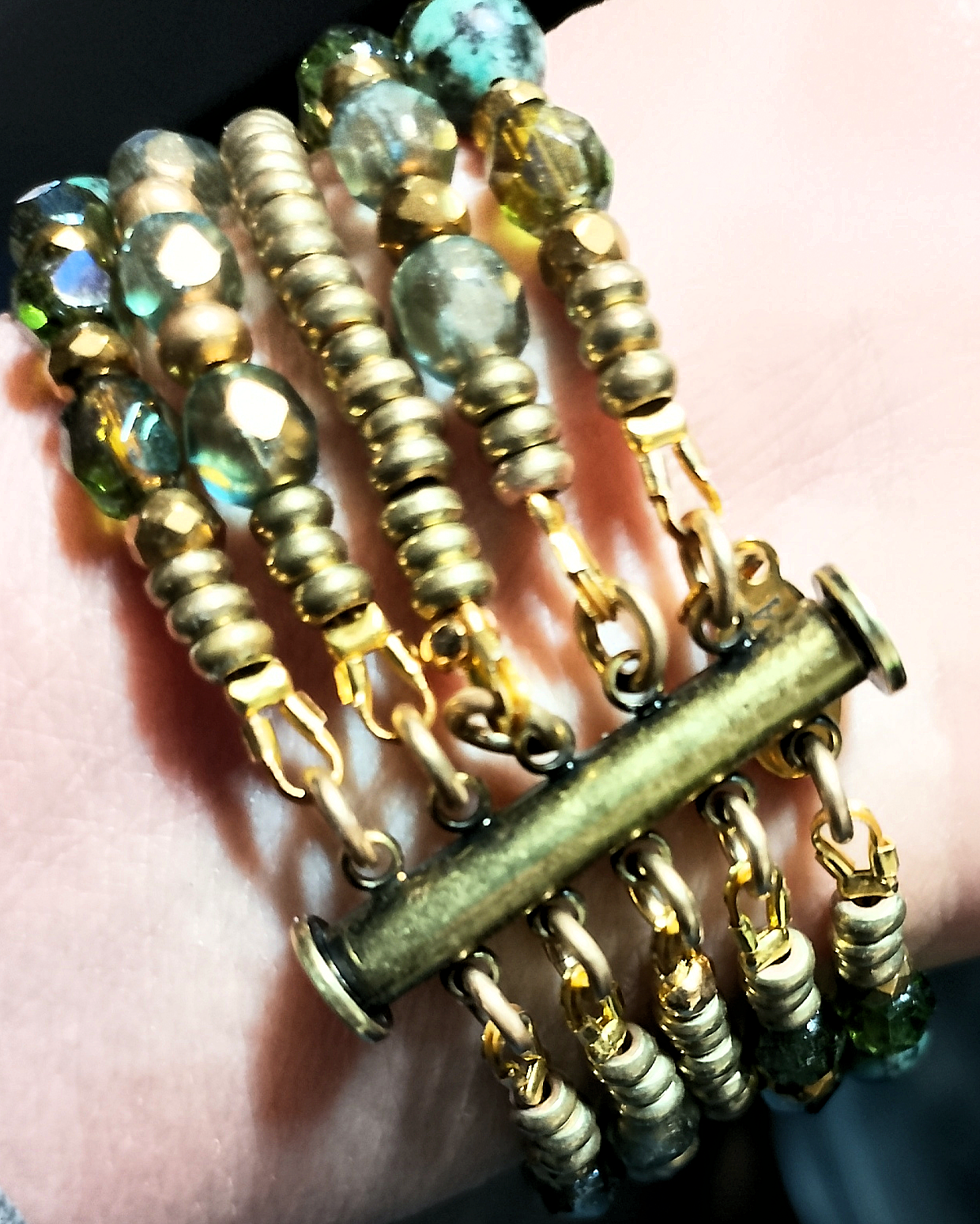 as viewed on designer's wrist are the gold-filled wire guards and vintage oxide brass magnetic tube clasp